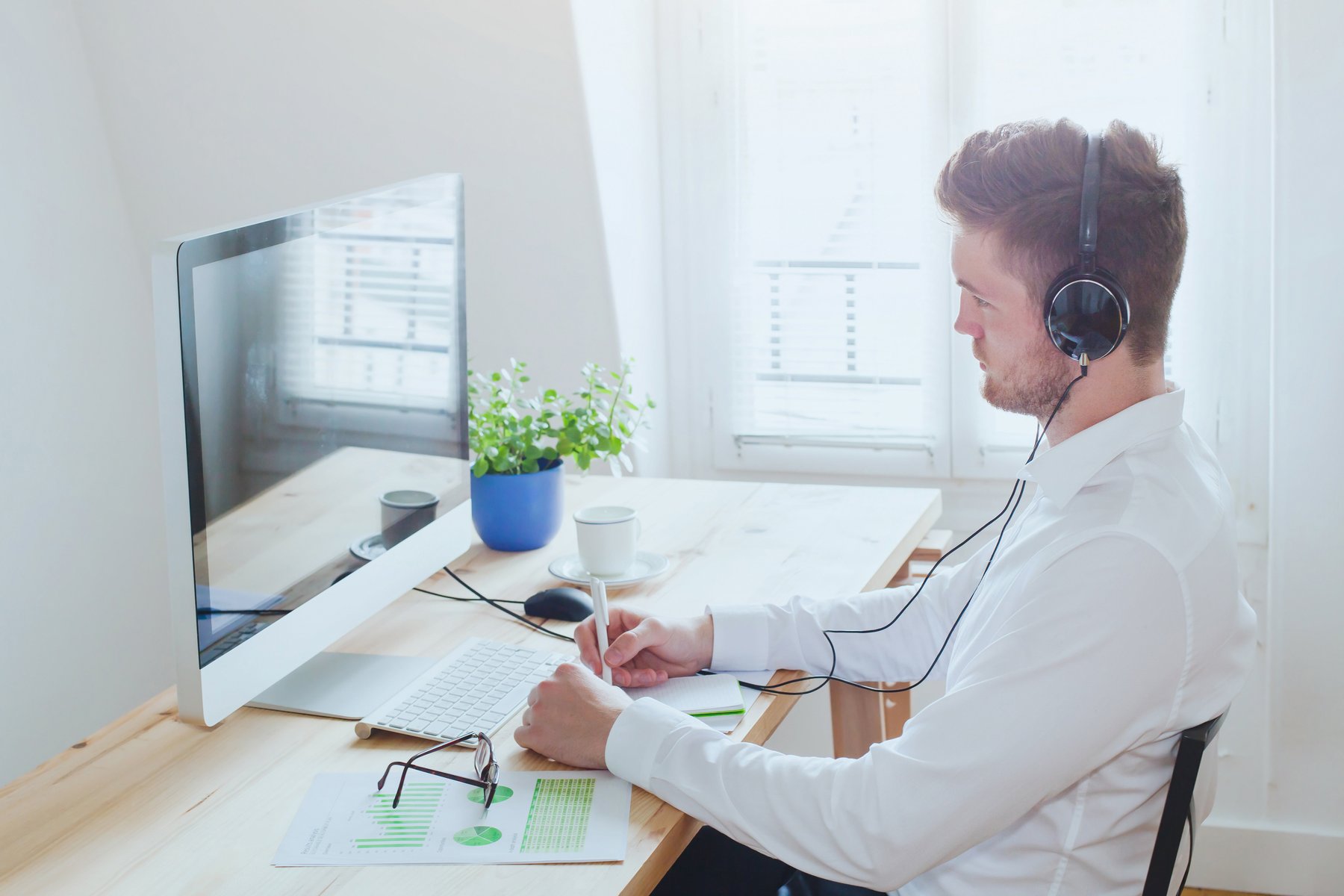 Man taking online training at desk