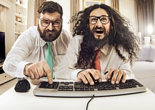 2 enthusiastic nerdy guys working simultaneously on a document with other authors