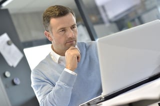 Photo of IT manager working at his laptop