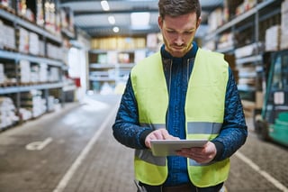 Photo of employee looking up order details on a tablet