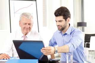 technician providing deskside support for businessman